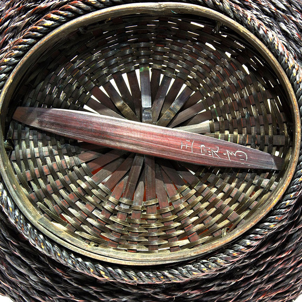 artist signature chiseled into bamboo