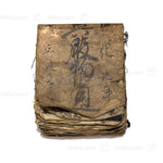 dirt covered book with writing