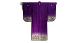 back of purple kimono with family crests and painted scene on hems