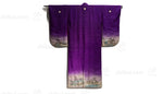 back of purple kimono with family crests and painted scene on hems