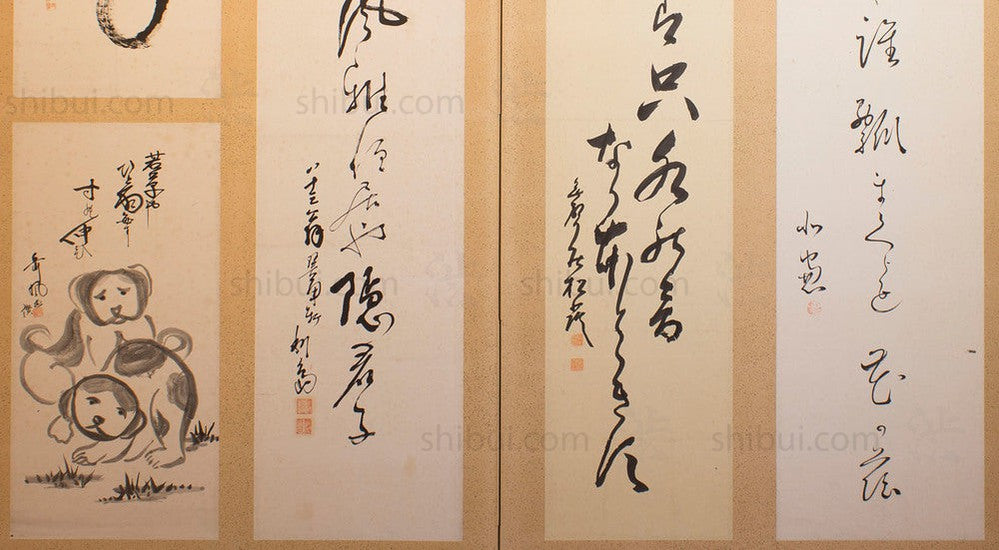 closeup of calligraphy screen with puppies