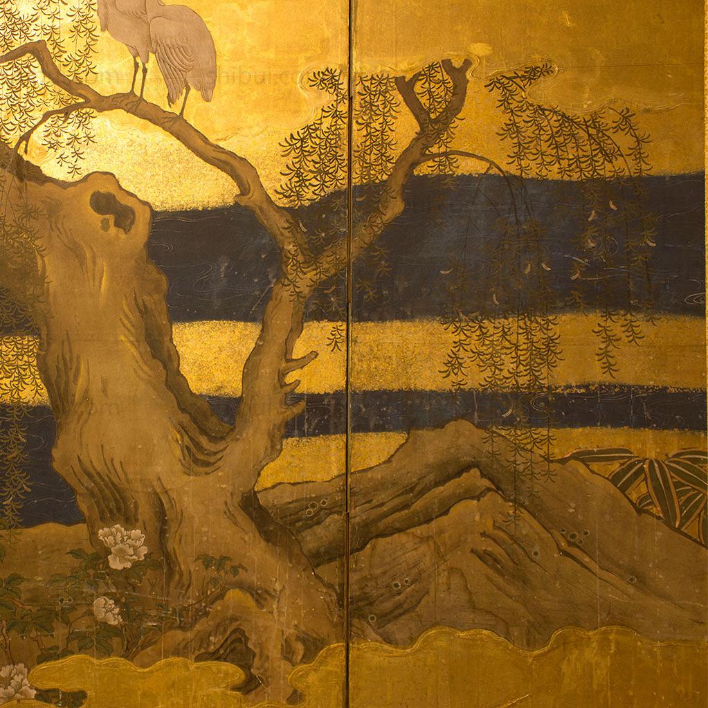 closeup of screen with tree and water