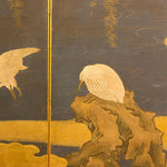 closeup of screen with heron on rock