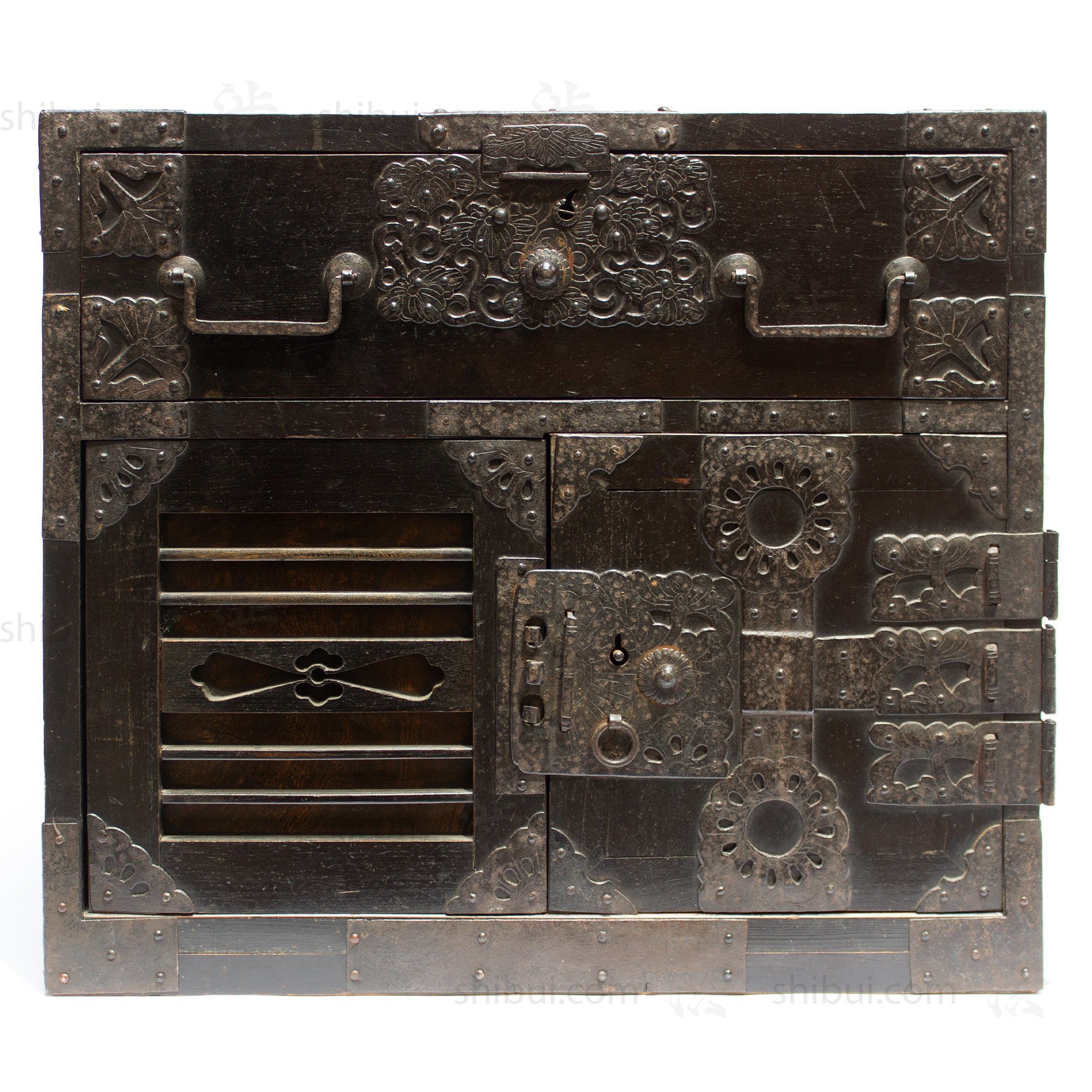 Front side of antique japanese sea chest (a kind of tansu) displaying ornate iron hardware. From the Edo period.