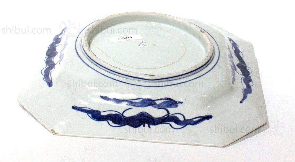 underside of white plate with blue detail