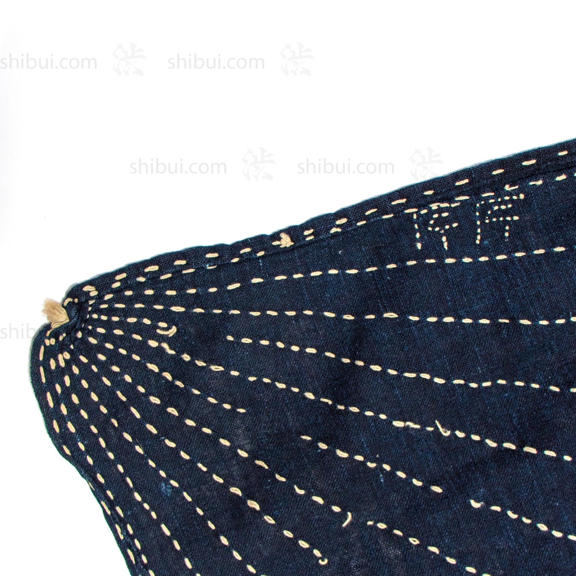 Detail of "Naka" (Chinese character) company insignia.