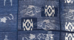 closeup of crane pattern on indigo