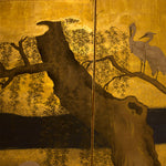 closeup of screen with tree and heron