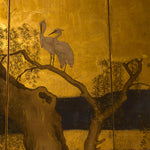 closeup of screen with tree and heron