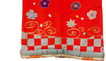 back hem of red kimono with embroidery and check pattern